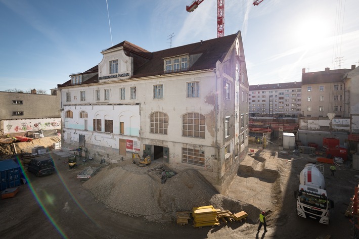 Rohbaustart für Sanierung der historischen Kuvertfabrik in München